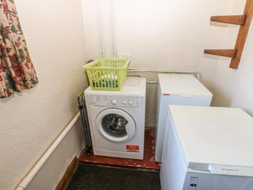 a washer and dryer in a small room at South View in Leyburn