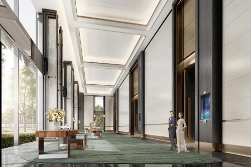 a rendering of the lobby of a building with a bride and groom at Capital International Exhibition & Convention Center Hotel in Beijing