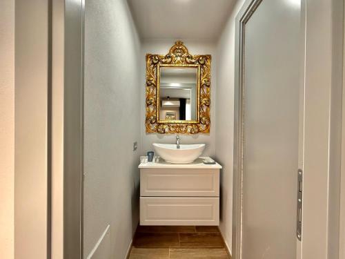 a bathroom with a sink and a mirror at Casbah, suites nel cuore di Menaggio in Menaggio