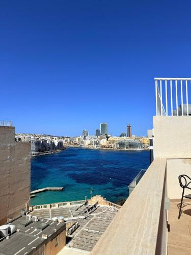 a view of a body of water from a building at Duplex Penthouse in Sliema in Sliema