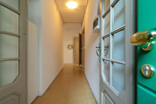 a hallway with a door at Welcomely - Casa Margherita in Varenna