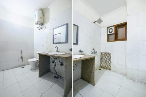 a bathroom with a sink and a toilet at Hotel Gracious - Civil Line in Gurgaon