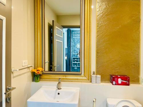 a bathroom with a sink and a mirror at The base Condo luxury room by Numam in Pattaya