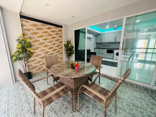 a dining room with a table and chairs at Patong best location Apartments, 2 bedrooms in Patong Beach
