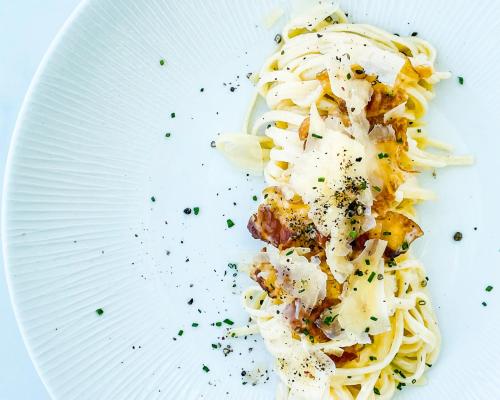 a plate of pasta on a white plate at Gennadi Grand Resort in Gennadi