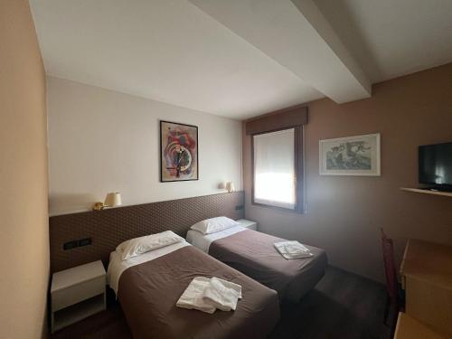Postel nebo postele na pokoji v ubytování Damodoro Hotel