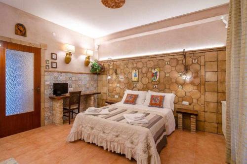 Ένα ή περισσότερα κρεβάτια σε δωμάτιο στο Casa della Giara, parcheggio, supermercato a 200m