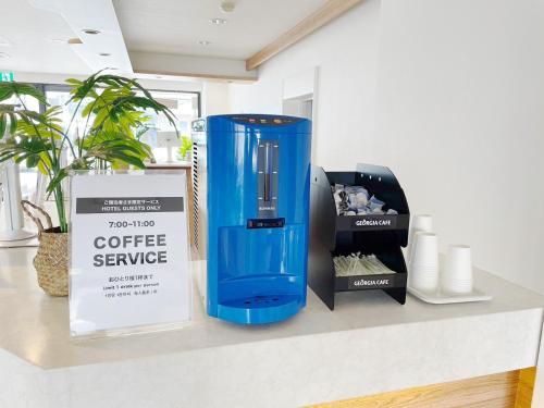 a blue container sitting on a counter next to a box at Miyazaki Mango Hotel - Vacation STAY 58252v in Miyazaki