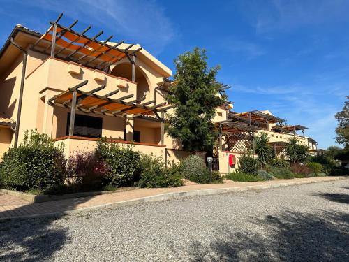 a house on the side of a road at Residence Talamone Il Poderino in Talamone