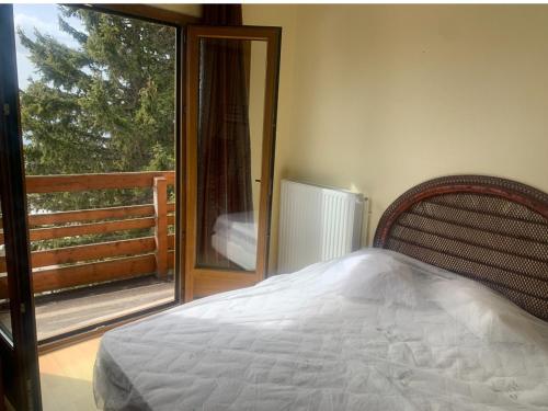 Ένα ή περισσότερα κρεβάτια σε δωμάτιο στο Chalet Alain