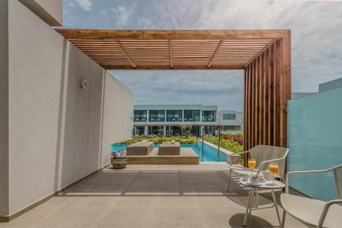 an outdoor patio with a view of a building at Gennadi Grand Resort in Gennadi