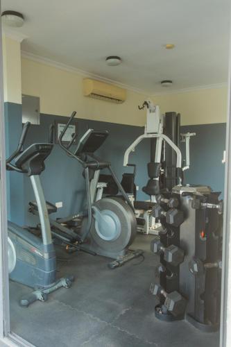 a gym with several exercise bikes in a room at Accra Luxury Apartments at Avant Garde in Accra