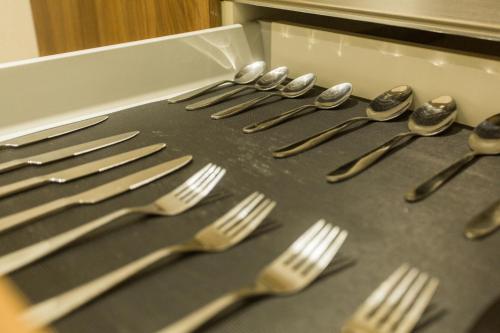 a group of forks and spoons on a table at Accra Luxury Apartments at Avant Garde in Accra