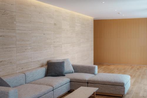 a living room with a couch and a table at Villa NIGIN in Miyazu