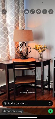 a table with a lamp on top of a desk at Mega Stunning Skyline View - APT 4-5 Combination - 6 Bedroom - Sleeps 25 - 15 mins to NYC in Union City