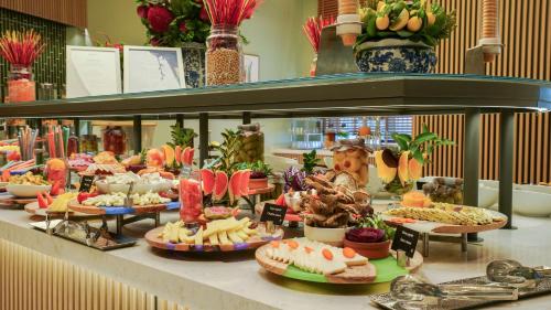 a buffet with many different types of food on display at Radisson Hotel Istanbul Merter in Istanbul