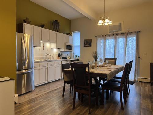 a kitchen and dining room with a table and chairs at Mega Trade Stunning View - APT 3-4 Combination in Union City
