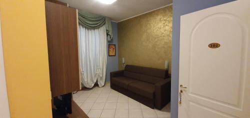 a living room with a couch and a window at La Lanterna in Silvi Marina