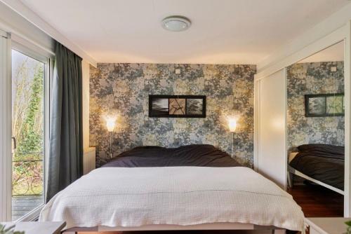 Ένα ή περισσότερα κρεβάτια σε δωμάτιο στο Recreatie Woning Drenthe Gasselte