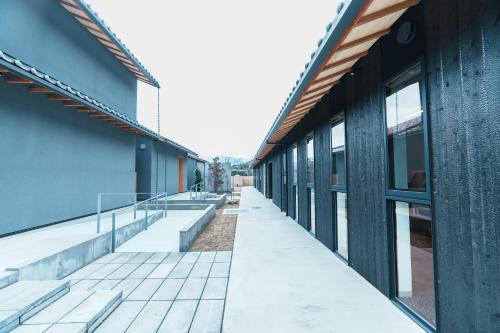 an empty corridor of a building with windows at Villa NIGIN in Miyazu