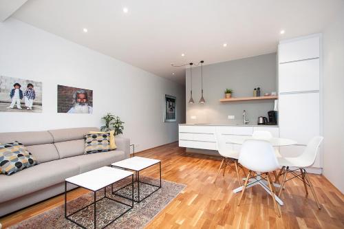 a living room with a couch and a table at Reykjavík Central Apartments in Reykjavík