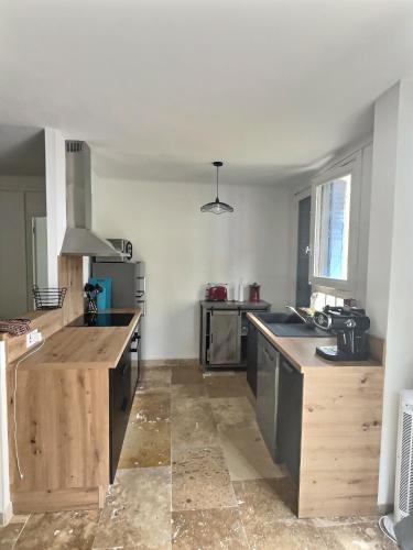 Photo de la galerie de l'établissement T4 de Standing au Centre de Carcassonne - Confort et Authenticité, à Carcassonne