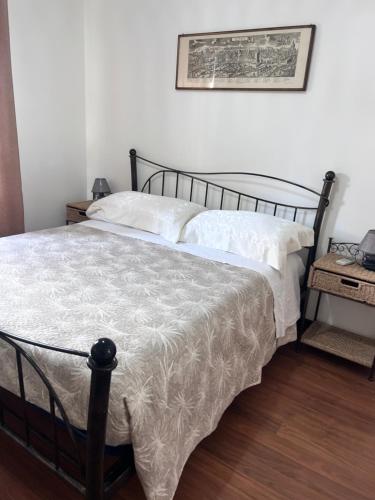 a bedroom with a bed with a blanket on it at Da Adriana Guesthouse in Santa Teresa Gallura