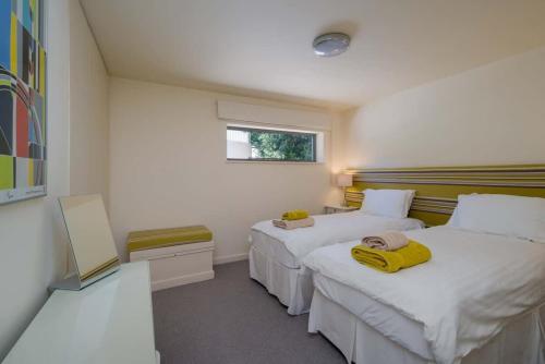 Voodi või voodid majutusasutuse Mainsail apartment toas