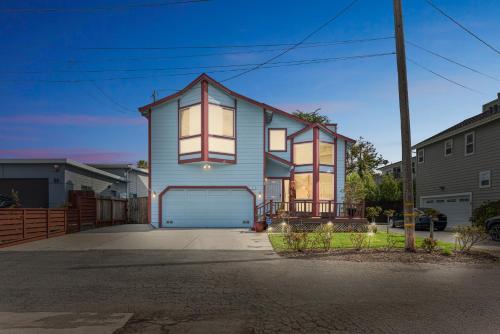 a house with a garage in a residential neighborhood at Coastal Getaway home in El Granada