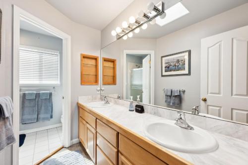 a bathroom with a sink and a mirror at Coastal Getaway home in El Granada