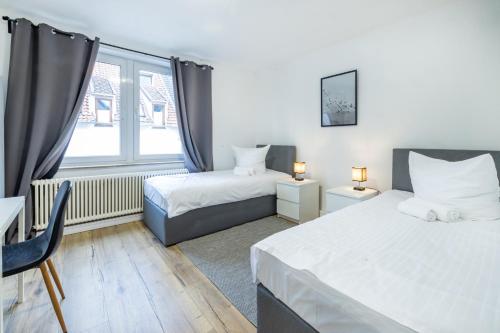 Postel nebo postele na pokoji v ubytování 3-Zi - 6 Personen - Zentral-Bielefeld - kostenloser Parkplatz
