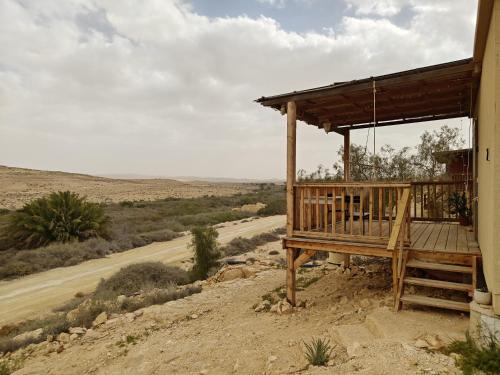 a porch of a house on the side of a road at DESERT Ezuz in ‘Ezuz