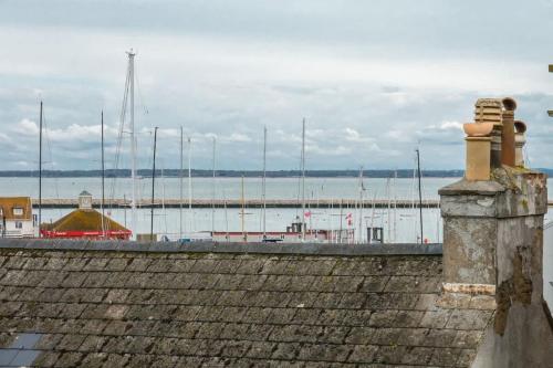 a view of a harbor with boats in the water at Composers apartment in Cowes