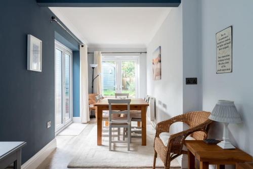 a dining room with a table and chairs at Fitzroy in Cowes