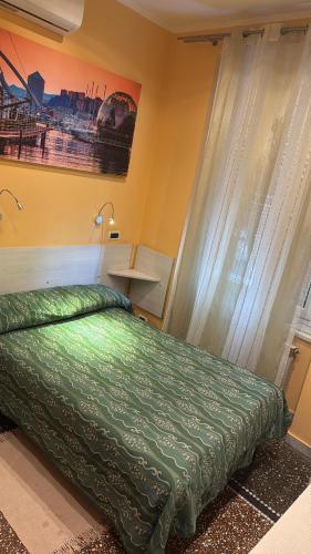 Ένα ή περισσότερα κρεβάτια σε δωμάτιο στο Albergo Parigi
