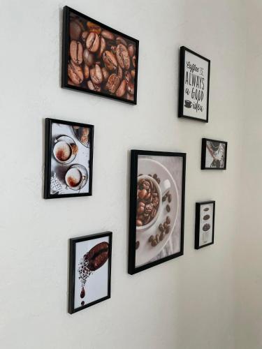 a wall with pictures of food on it at Parka ielas apartamenti in Alūksne