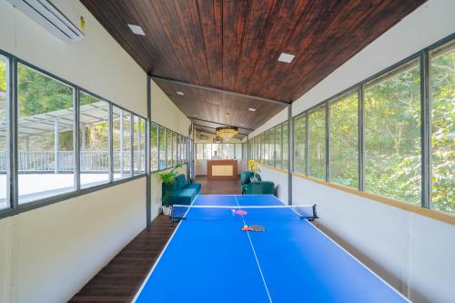 a room with a ping pong table in it at Perfectstayz The Silhouette in Shivpuri