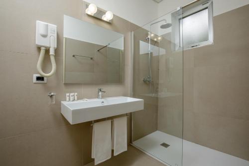 a bathroom with a sink and a shower at Hotel Marc'Aurelio in Rome