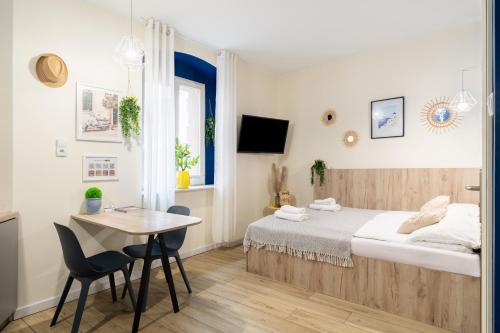 Posteľ alebo postele v izbe v ubytovaní Aparthotel przy Bulwarze by Rentoom