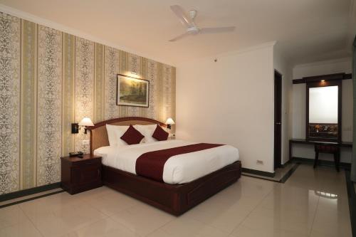 a bedroom with a large bed in a room at Rustic Leisures Resort in Cochin