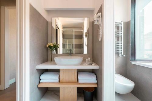 a bathroom with a sink and a mirror at Atlante Star Hotel in Rome
