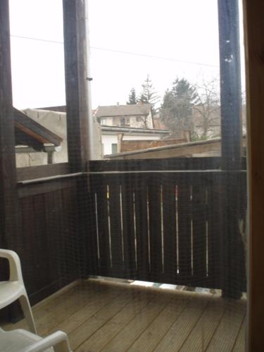 a balcony with a black fence and a window at Belvárosi Vendégház in Miskolc