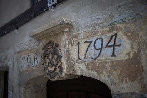an entrance to a building with a clock on it at Rathewalder Mühle in Rathewalde