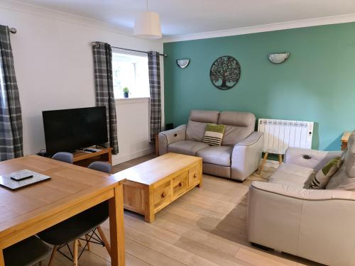 a living room with a couch and a table at Tees Valley Apartments in Middlesbrough