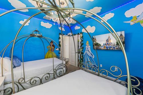 a childs bedroom with a disney princess bedroom at 295 Marcello Blvd in Kissimmee