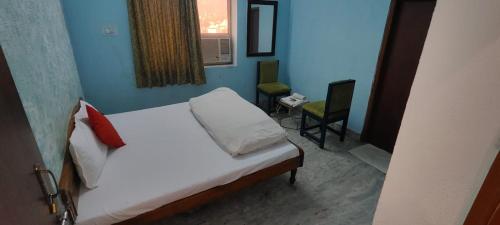 Cama o camas de una habitación en Haveli Banquet & Resort