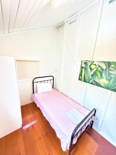 Ένα ή περισσότερα κρεβάτια σε δωμάτιο στο Beach accommodation with Shared facilities