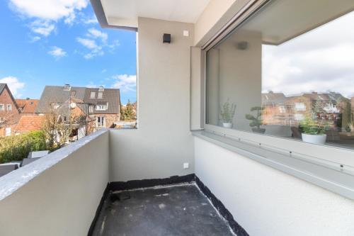 a balcony with a view of the city at 24-7 Living - Lüdinghausen Apartments in Lüdinghausen
