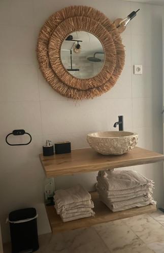 a bathroom with a sink and a mirror at B&B Villa Victoria in Mijas