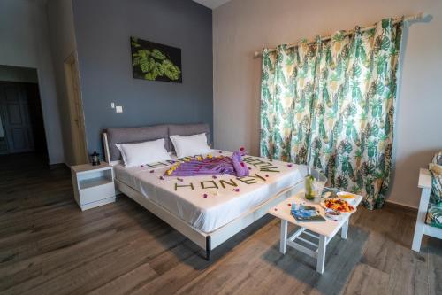 a bedroom with a bed with a stuffed animal on it at La Casa Sorento in Victoria
